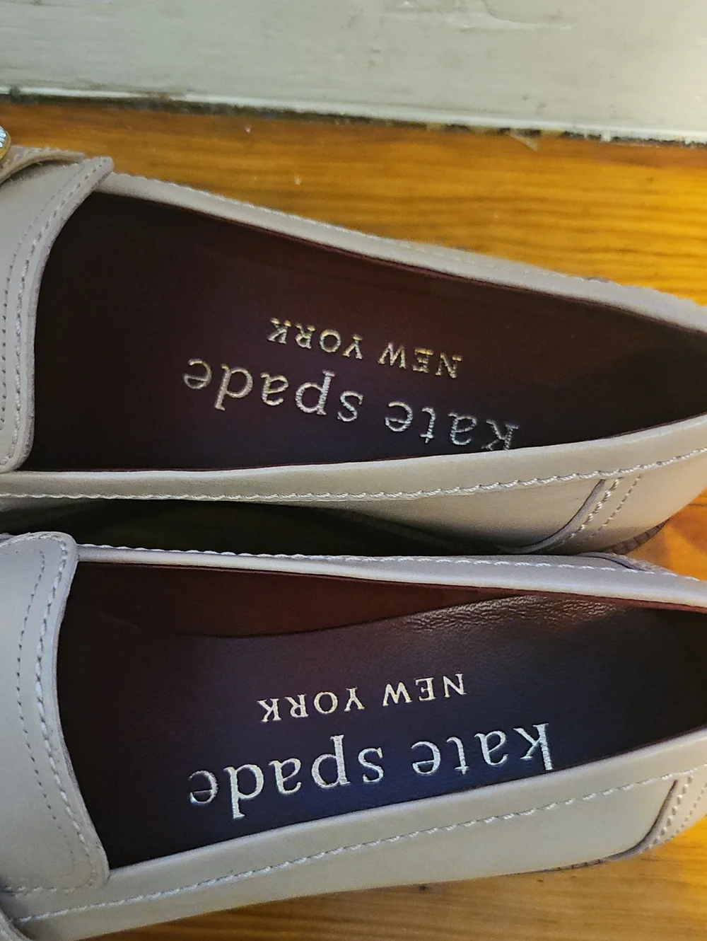 Kate Spade Cream Loafer with Decorative Gem Accent